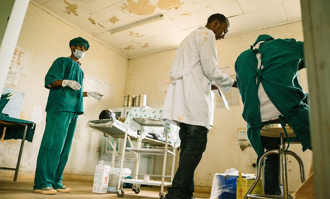 Doctors prepare to perform surgery.