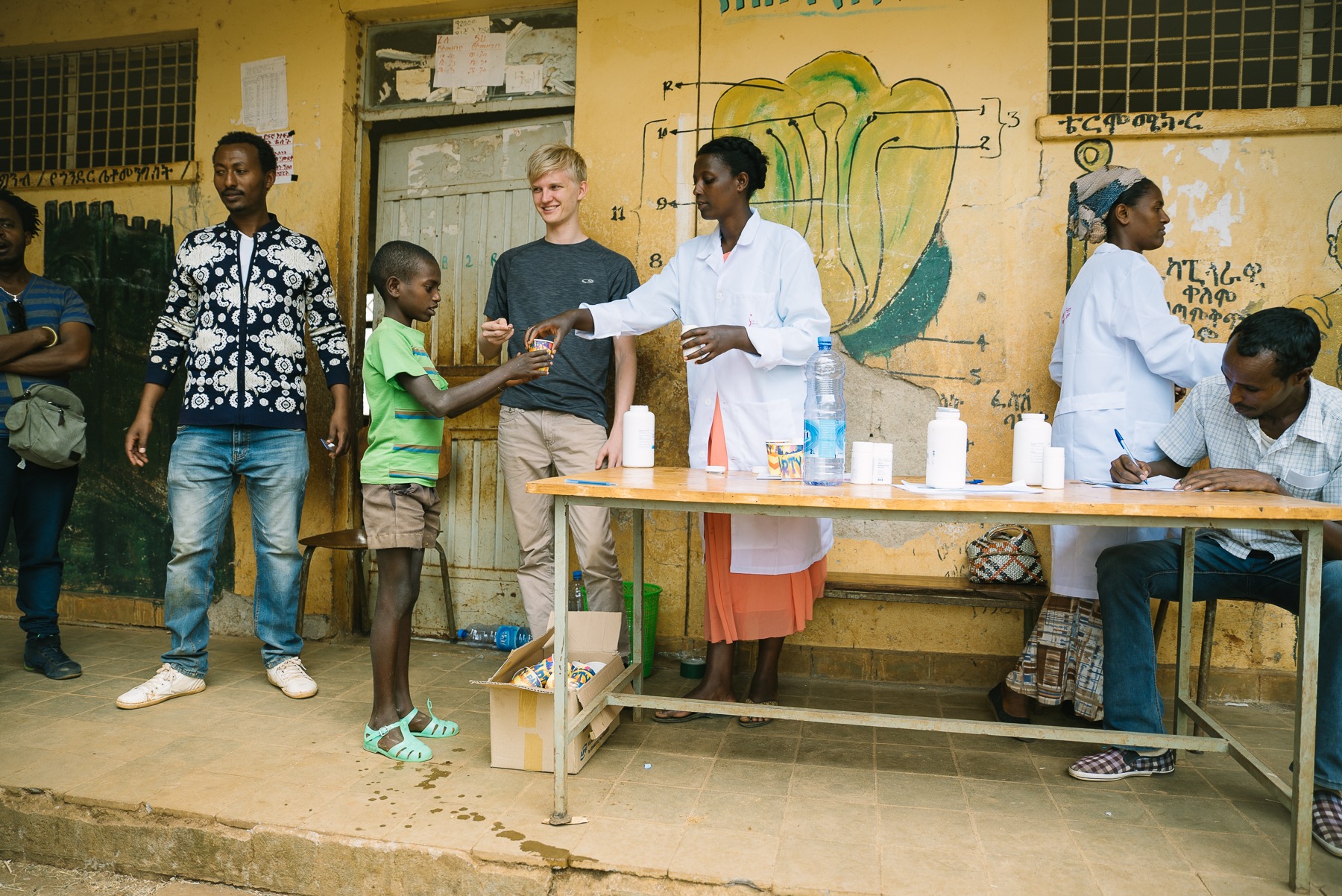 Community Drug Distributor handing out medicine