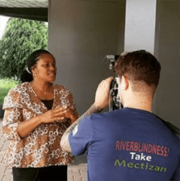 Woman being interviewed in front of camera as part of END Fund media.