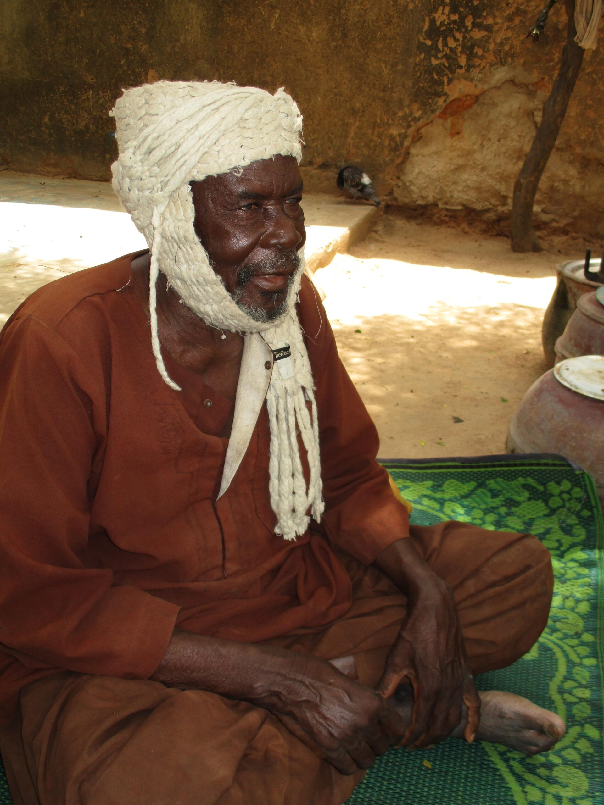 Man sitting on the ground.