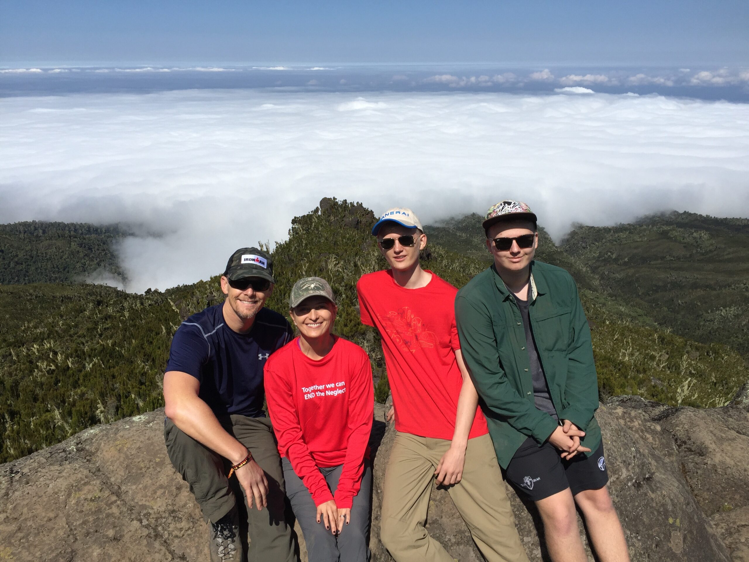 Climbers pose while resting on Kilimanjaro.